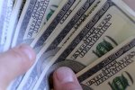 man-s-hand-holding-one-hundred-dollar-bill-192706762.jpg